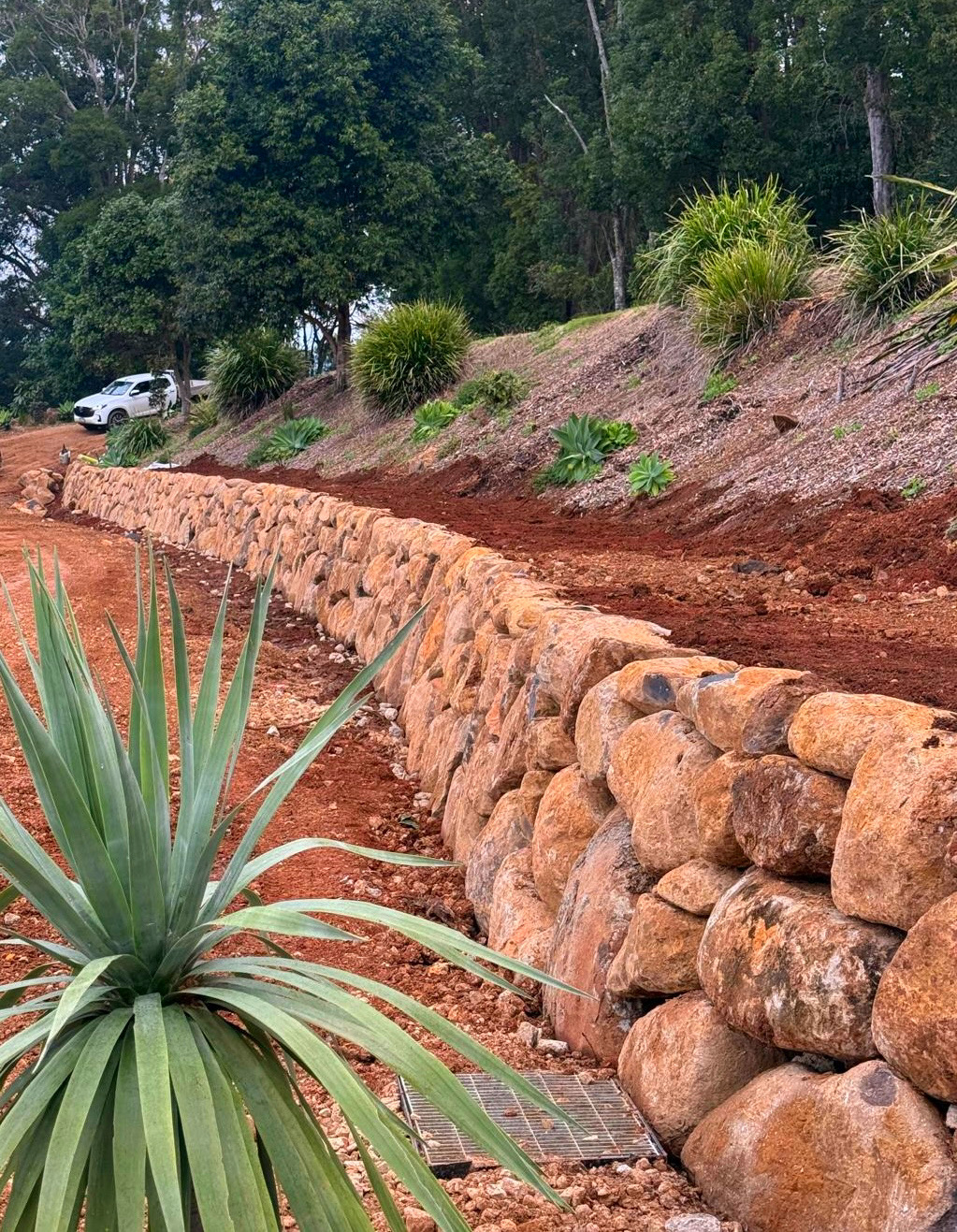 Basalt bushrock wall built on a sloping site
